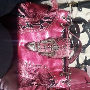 Pink purse with snake skin print
